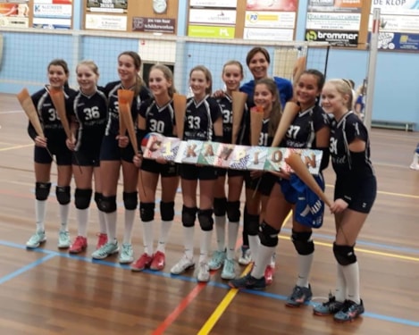 het team met hun coach